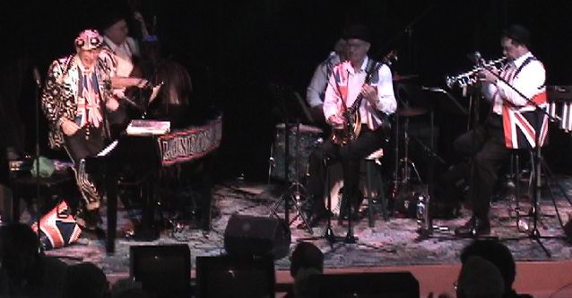 [LB in pearly suit stage left]